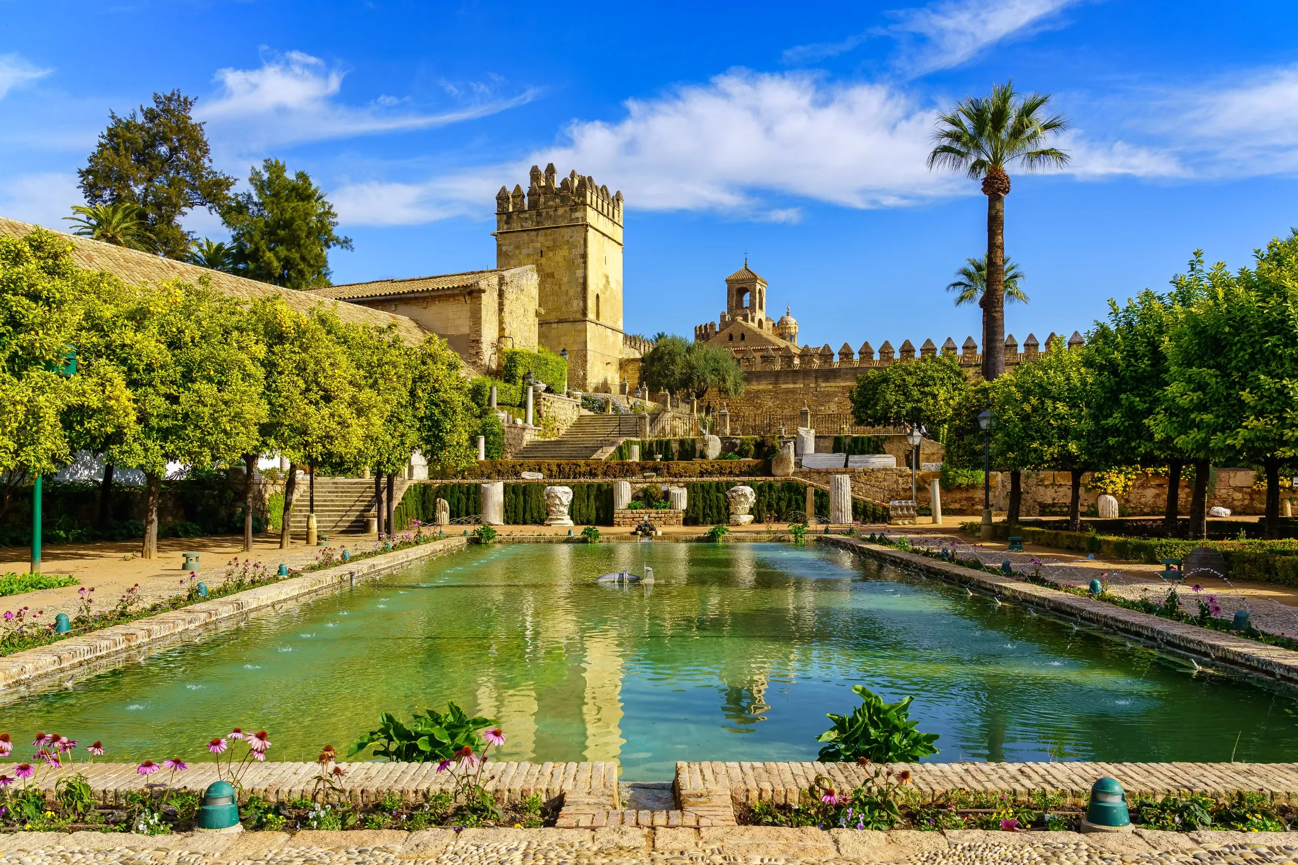 Cordoba, Spain, November 12, 2021: Panoramic view of the impressive Alcazar de Cordoba and its royal gardens in Andalusia, Spain.