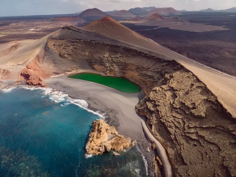 Volcanic crater with a crater lake near El Golfo, Lanzarote island. Aerial view