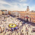 The Puerta del Sol square is the main public square in the city of Madrid, Spain. In the middle of the square is located the office of the President of the Community of Madrid.