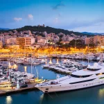 Palma de Mallorca, Spain skyline at the port with yachts in the early morning.