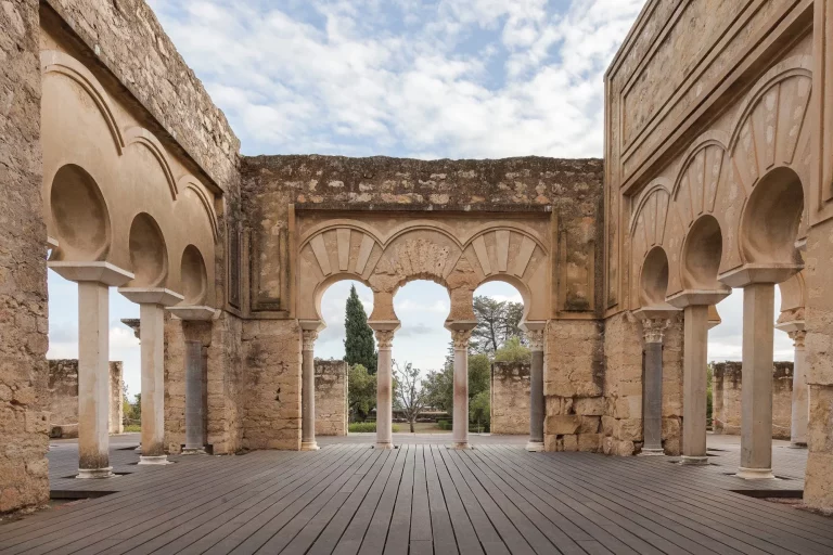 Remains of a very old city with stone walls and arches.