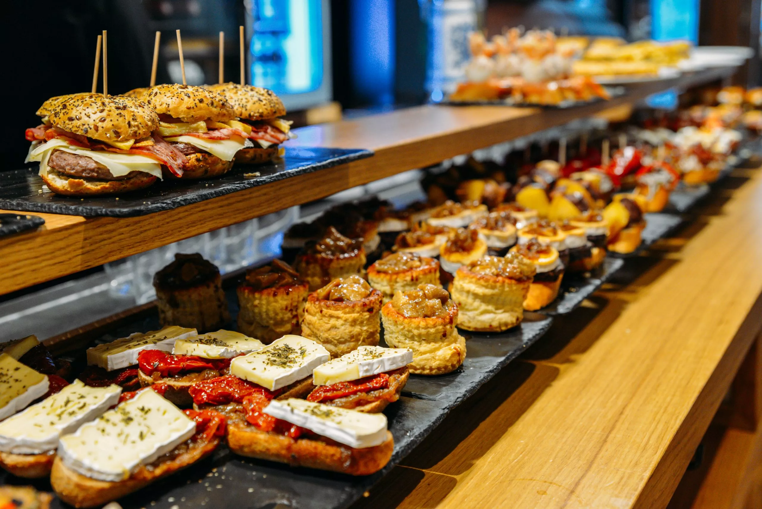 Spanish tapas called pintxos of the Basque country served on a bar counter in a restaurant in San Sebastian, Spain