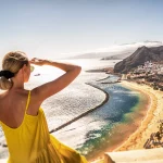 Amazing place to visit. Woman looking at the landscape of Las Teresitas beach and San Andres village, Tenerife, Canary Islands, Spain. Tourism. Vacation. Travel.
