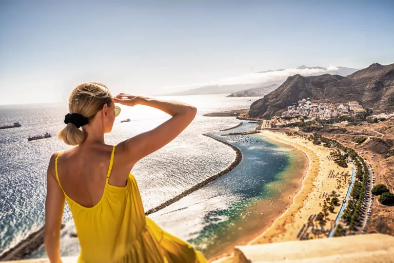 Amazing place to visit. Woman looking at the landscape of Las Teresitas beach and San Andres village, Tenerife, Canary Islands, Spain. Tourism. Vacation. Travel.