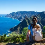 Woman hiker watching beautiful costal scenery. - Tenerife, Canary Islands, Spain. coast view, mountain Anaga